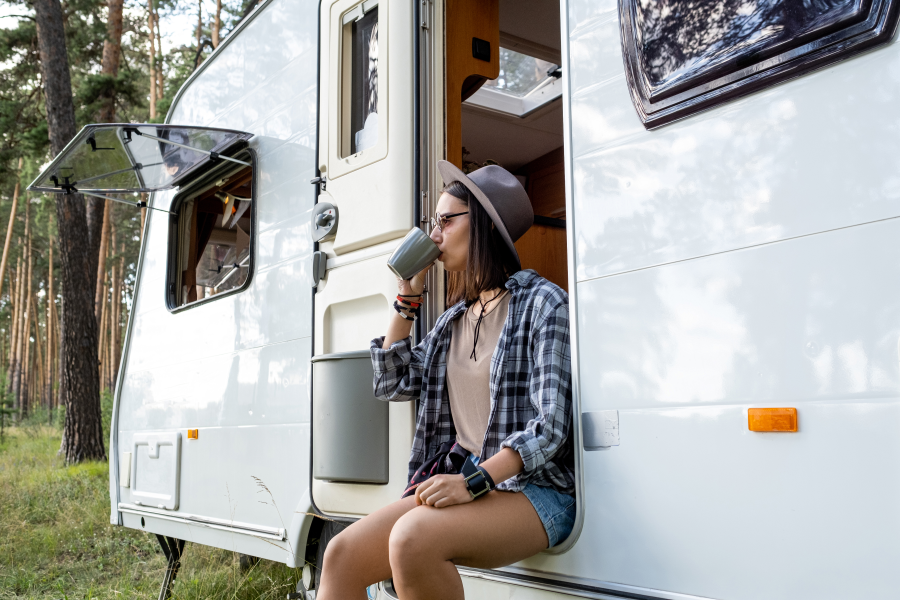 young-woman-hat-casualwear-drinking-tea-while-relaxing-house-wheels-hike